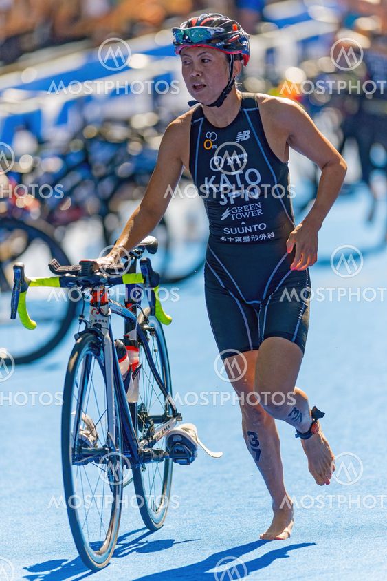 Yuri Kato (JPN) running thru the transition area with the...
