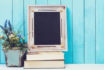 Wooden items of home decor close up on blue wooden...