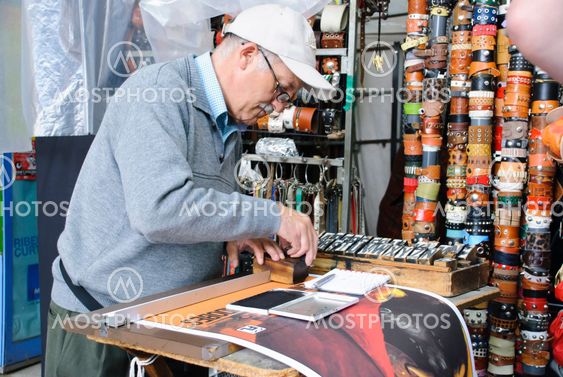 Man typesetting letters for poster, Madrid