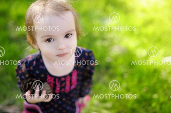 Adorable girl holdin two cones