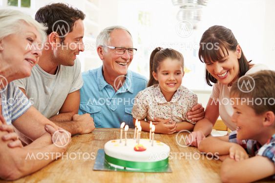 Multi Generation Family Celebrating Son's Birthday