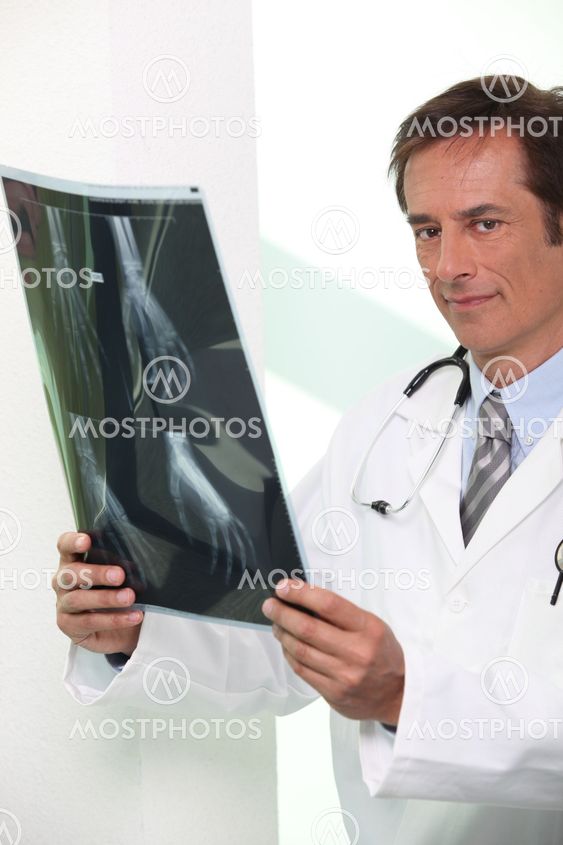 Doctor looking at X-ray