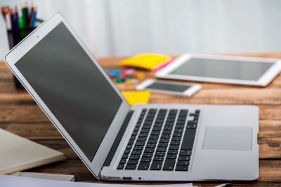 laptop computer on wood table