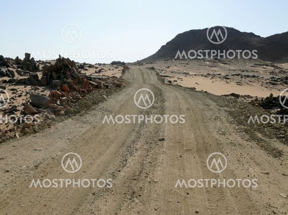 The road running through the Sahara desert.