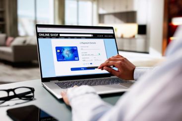 Woman Online Shopping On Laptop