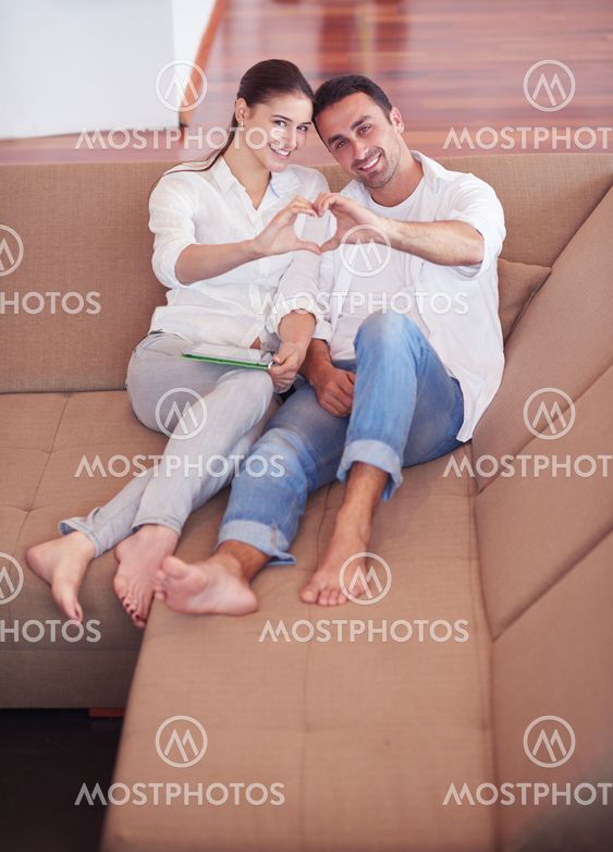 happy young romantic couple have fun and relax at home