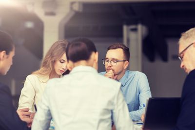 smiling business people meeting in office