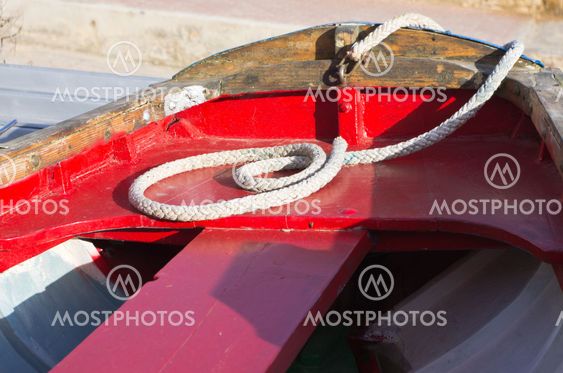 Red boat with rope