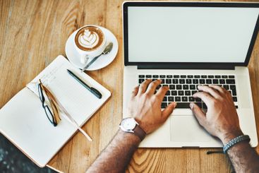 Remote work, coffee and hands of person at laptop screen...