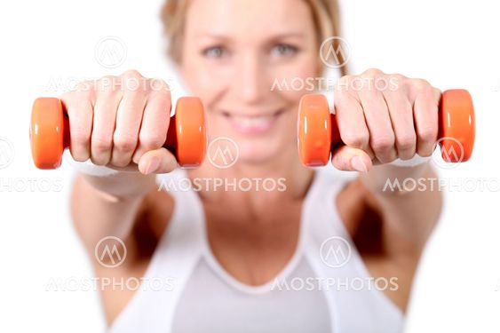 Woman using hand weights during fitness session