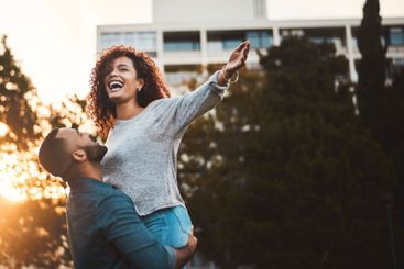 Lift, happy and couple laugh in morning for fun, playful...
