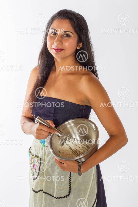 Pretty Indian Woman Mixing Cake