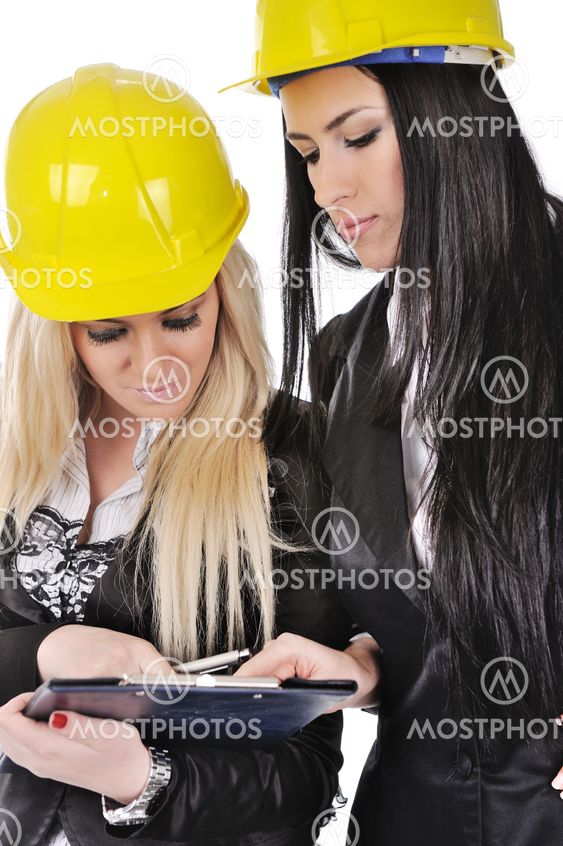 Two architect girls writing