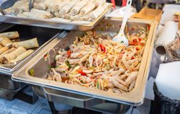 Delicious Asian street food market with takeaway meals,...