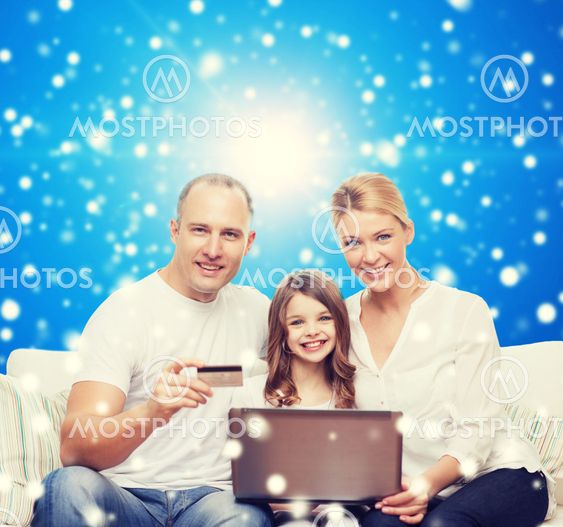 happy family with laptop computer and credit card