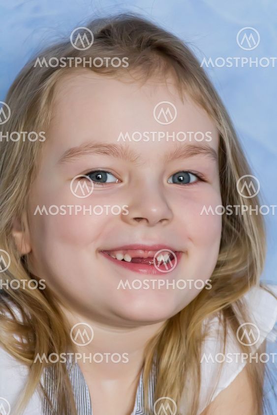 Smiling toothless girl with blond hair
