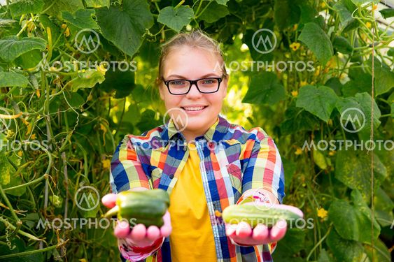 Girl working in a greenhouse