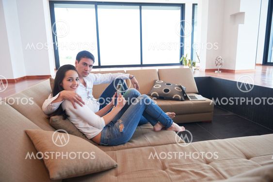 couple at modern home using tablet computer