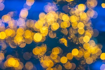 Out of focus christmas lights in blue evening light.