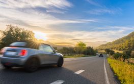 rental car in spain mountain landscape road at sunset