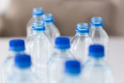 close up of plastic bottles with drinking water
