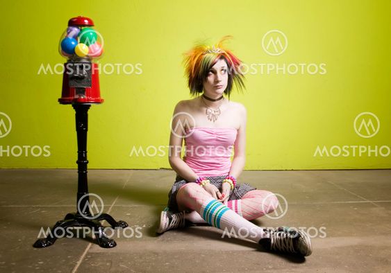 Punk Girl in front of a Green Wall