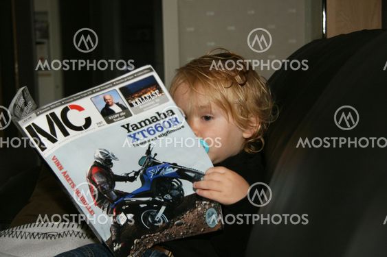 Child reading magazine