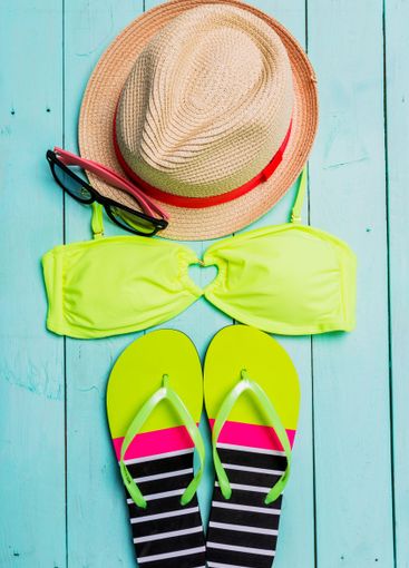 Beach accessories with yellow swimming suit,sunglasses...