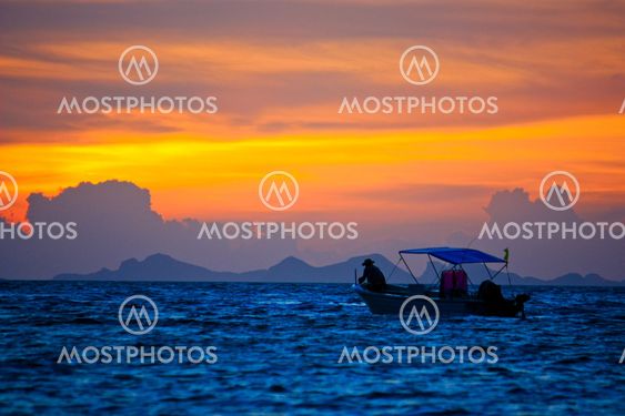 Silhouette boat in the sea