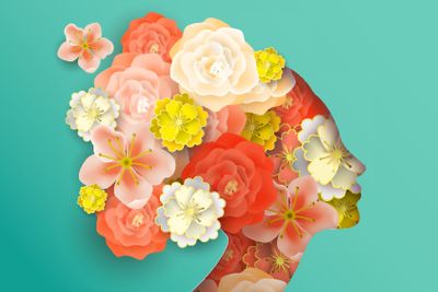 Papercut woman head with spring flowers