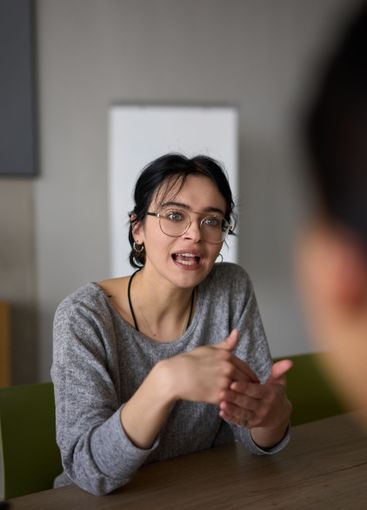 A close up portrait of a young businesswoman engaged in...