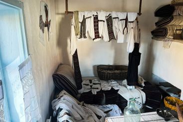 Traditional clothing and decor in a vintage ethnographic...