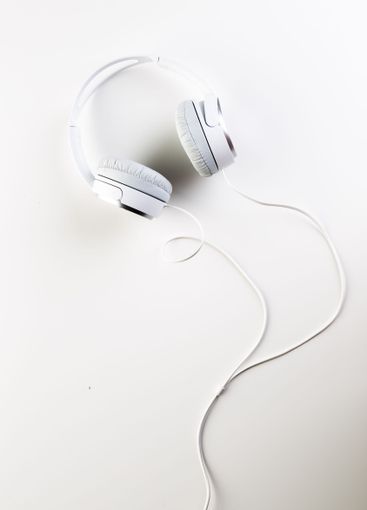 White headphones on white background close up