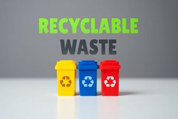 Colored containers for recyclable waste. Streamline...