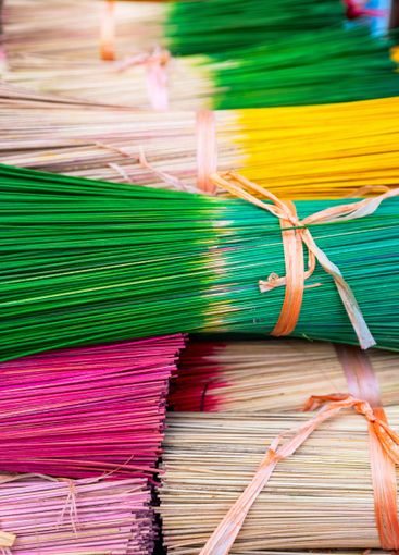 Bundles of colorful incense sticks tied together