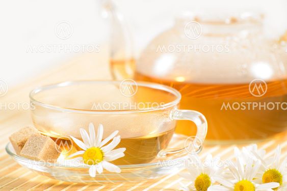 teacup with herbal chamomile tea
