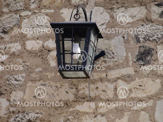 Street lamp on building wall