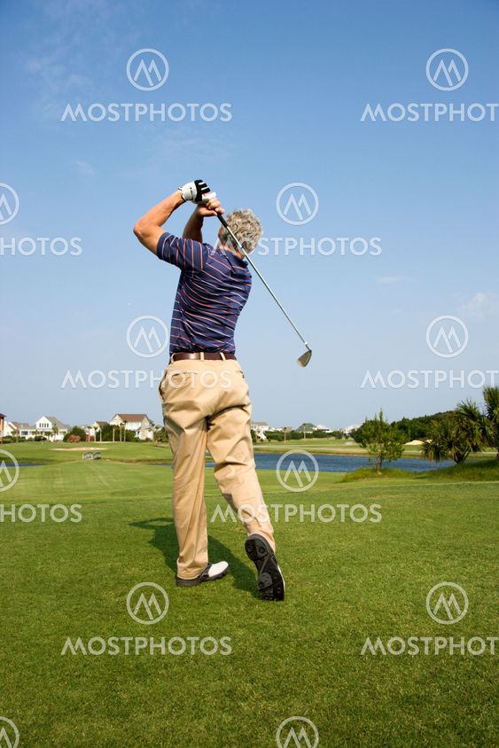 Man playing golf.
