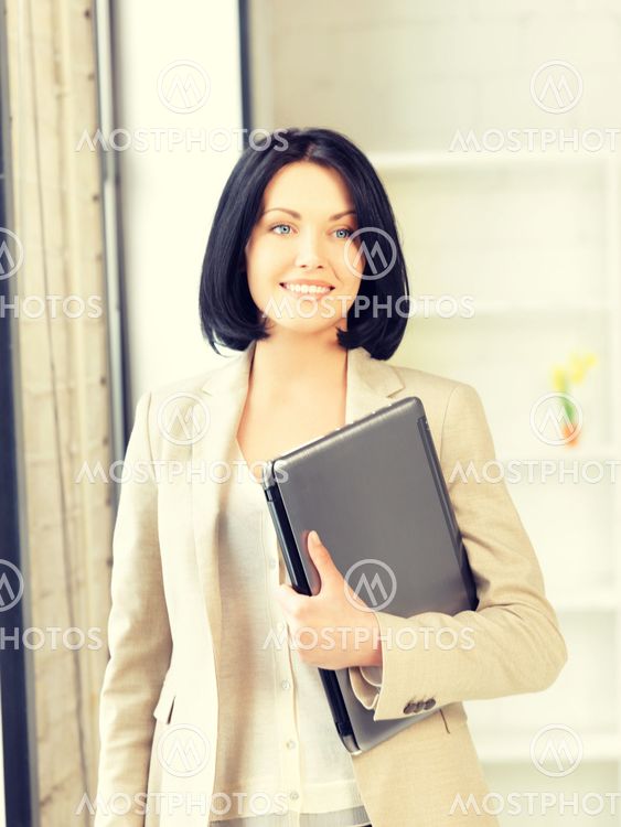 happy and smiling teenage girl with laptop