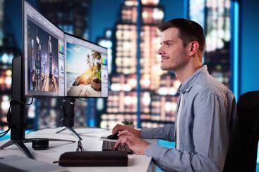 Graphic Designer Working On Computer Editing