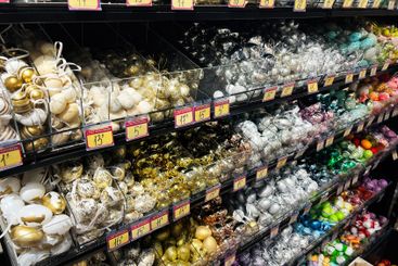 Variety of decorative Christmas ornaments arranged on...