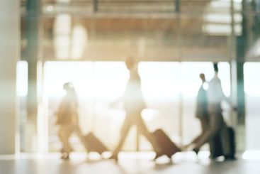 Blurred background, travel and business people in an...