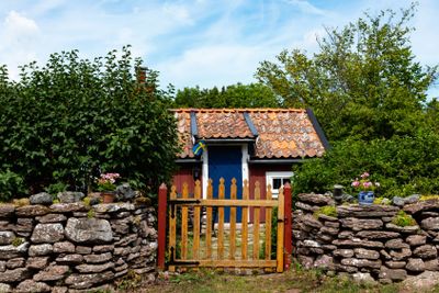 Old red wooden cottage on the island of Öland
