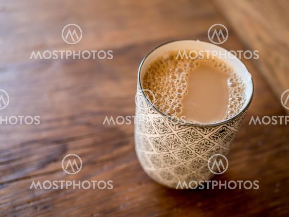 Swedish coffee with milk in a cup or a mug on wood rustic...
