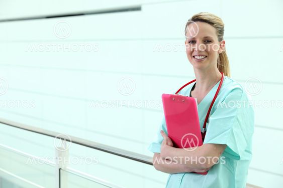 Nurse standing in corridor