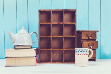 Wooden items of home decor close up on blue wooden...