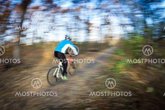 Bicycle riding in a city park on a lovely autumn/fall day