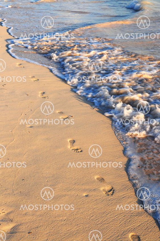 Footprints on sandy beach