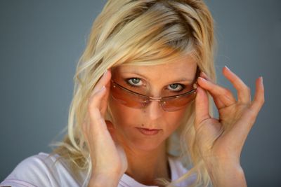 Moody blond woman wearing sunglasses