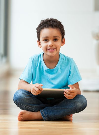 African american little boy using a tactile tablet